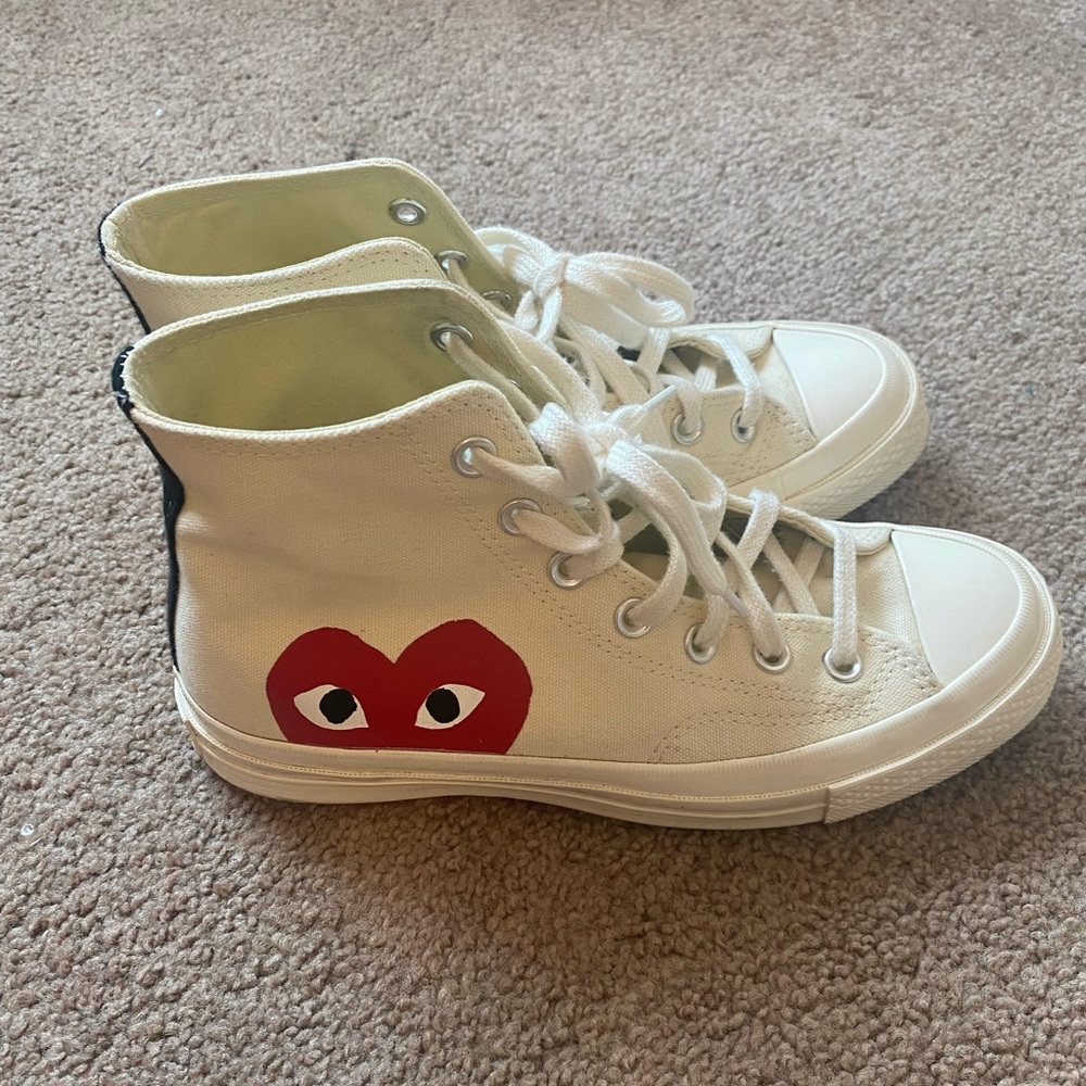Lightly used white converse, size 8 in women.